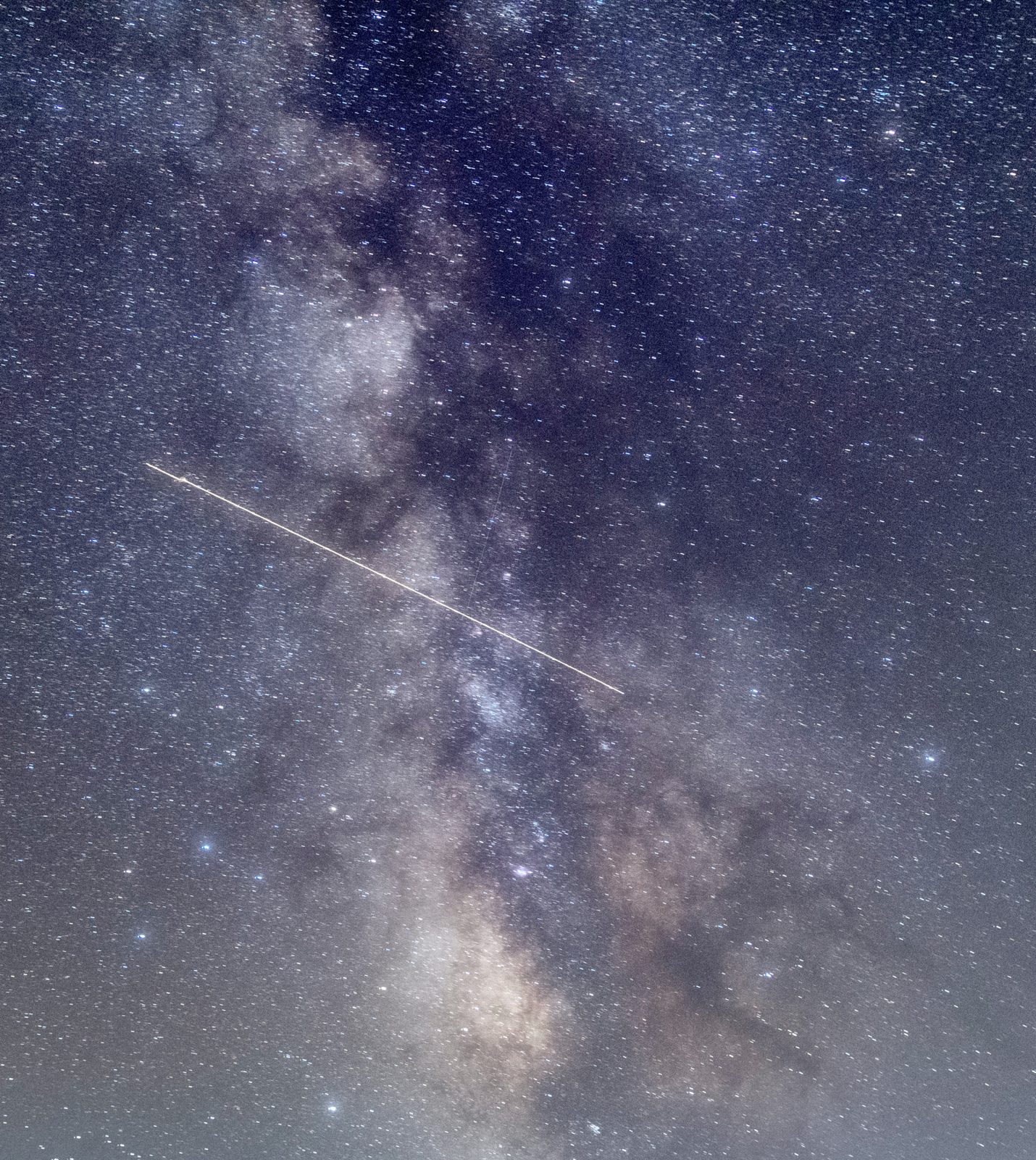 The Milky Way and a meteor streak in the night sky at Cherry Springs State Park